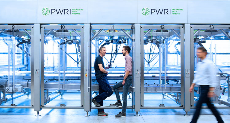 Discover how PWR’s automated packaging solutions are driving efficiency in the food industry workers inside PWR facility