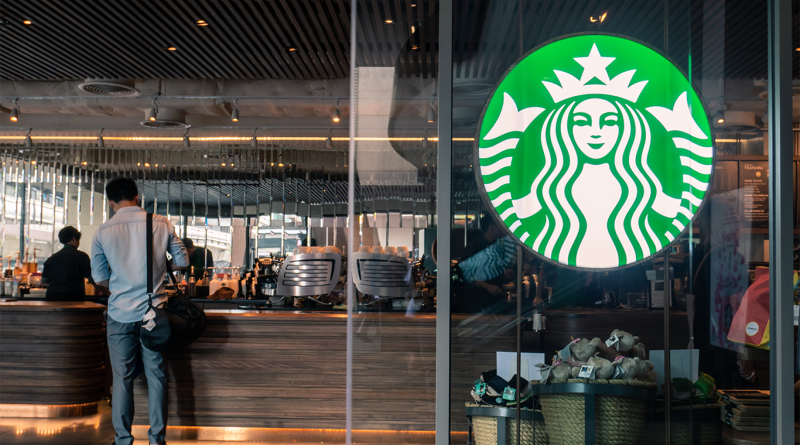 Starbucks: In-Store Experience, New Policies and Free Refills Starbucks store front with customer inside getting free refill